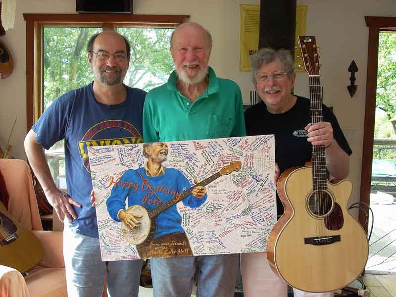 Presentation of 90th birthday card to Pete Seeger at his home