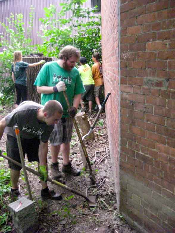 Ben and Jerry's Community Action Team clearing the bakery foundation