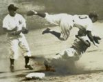 Jackie Robinson stealing a base from Phil Rizzuto in the 1947 Wold Series