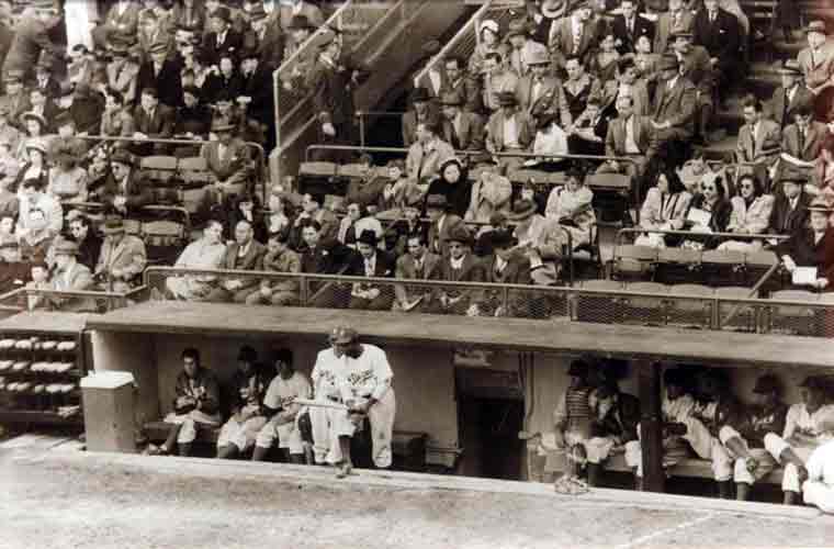 Jackie Robinson in the dugout before his first at bat in the Major Leagues -1947